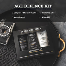 Percy Nobleman Age Defence Kit, a men's skincare set containing Charcoal Face Scrub (with Natural AHAs), ultra-hydrating Facial Serum (with Hyaluronic Acid), and Moisturiser (with Vitamin C)