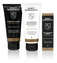 Percy Nobleman Age Defence Kit, a men's skincare set containing Charcoal Face Scrub (with Natural AHAs), ultra-hydrating Facial Serum (with Hyaluronic Acid), and Moisturiser (with Vitamin C)