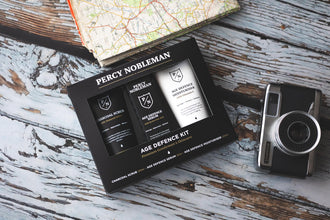 Percy Nobleman Age Defence Kit, a men's skincare set containing Charcoal Face Scrub (with Natural AHAs), ultra-hydrating Facial Serum (with Hyaluronic Acid), and Moisturiser (with Vitamin C)